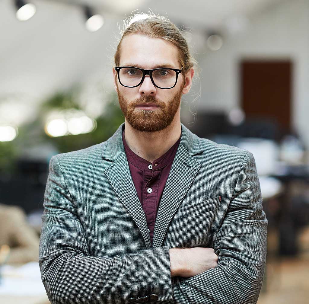 Man with beard, glasses, blazer, arms crossed - Bay Area Mobile Notary Services