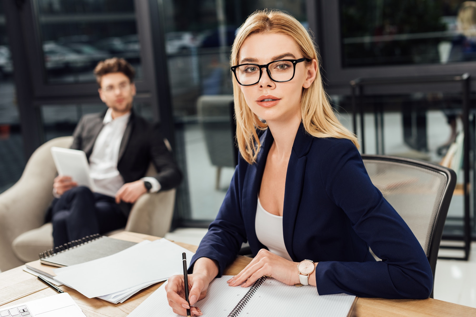 A woman is working at her office desk - Bay Area Mobile Notary Services ( Mobile Notary )